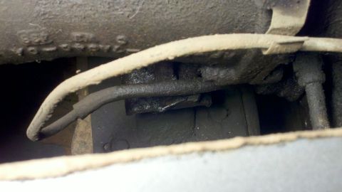 1978 Ford Bronco - Undercarriage view shows brake lines and frame components, with some visible markings.