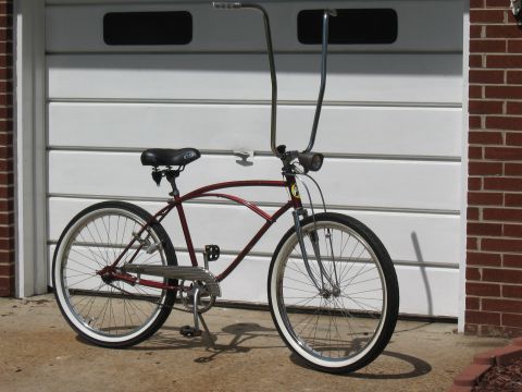 1994 Ford Bronco - Cruiser bicycle with a distinctive frame and high-rise handlebars.