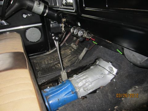 1979 Ford Bronco - Interior view of a 1979 Ford Bronco with transmission removed and auxiliary gauges installed.
