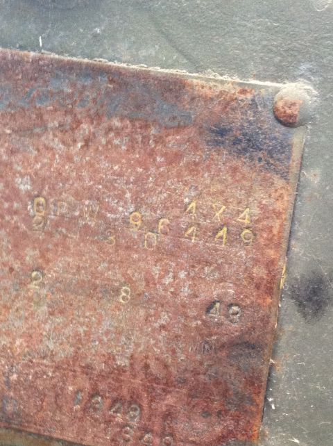 1986 Ford Bronco - This is a close-up of a vehicle's identification plate, showing stamped alphanumeric characters.