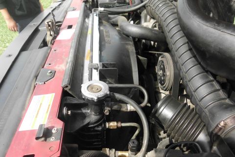 1994 Ford Bronco - Close-up view of the engine bay of a 1994 Ford Bronco, highlighting the radiator and fan assembly.