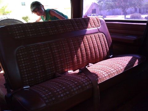 1981 Ford Bronco - The interior of a 1981 Ford Bronco shows its rear bench seat with a distinctive patterned fabric.