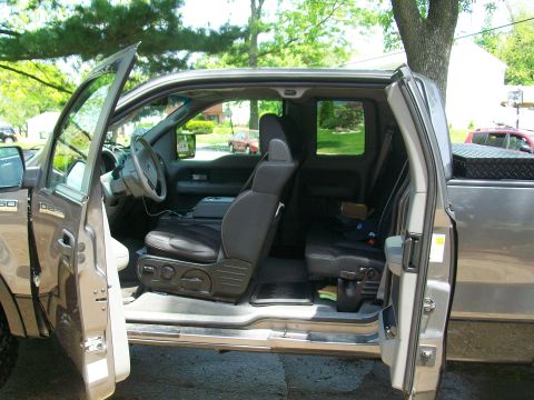 2008 Ford F-150 - Pickup truck interior with front doors open, revealing the seats and dashboard.