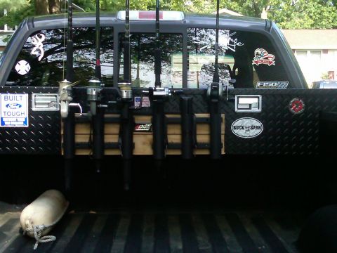 2008 Ford F-150 - Truck bed setup for fishing, rod holders and multiple fishing rods. The truck appears to be a 2008 Ford F-150.