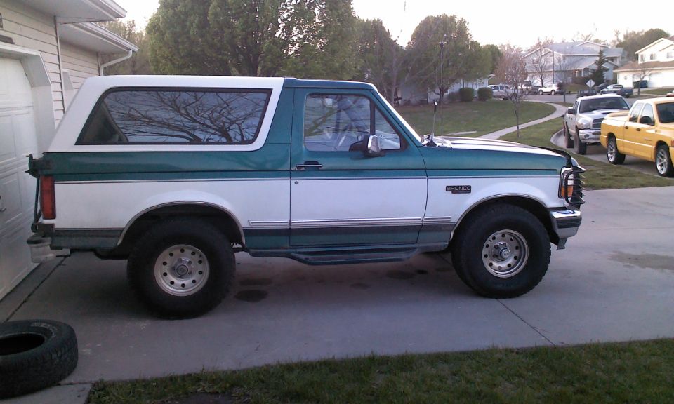1996 Ford Bronco parked in driveway, side view