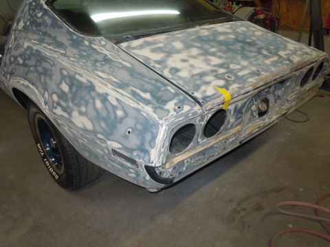 1973 Chevrolet Camaro - This 1973 Chevrolet Camaro is in the process of body repair, with primer and filler visible on its rear end.