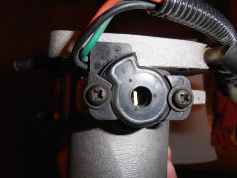 1990 Ford Bronco - Throttle body assembly with CTS markings and visible wiring.