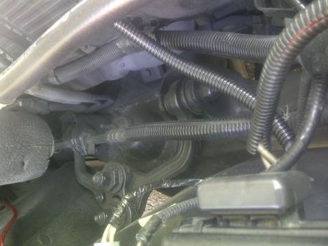 2000 Ford Crown Victoria - Close-up view of the steering linkage components underneath a 2000 Ford Crown Victoria.