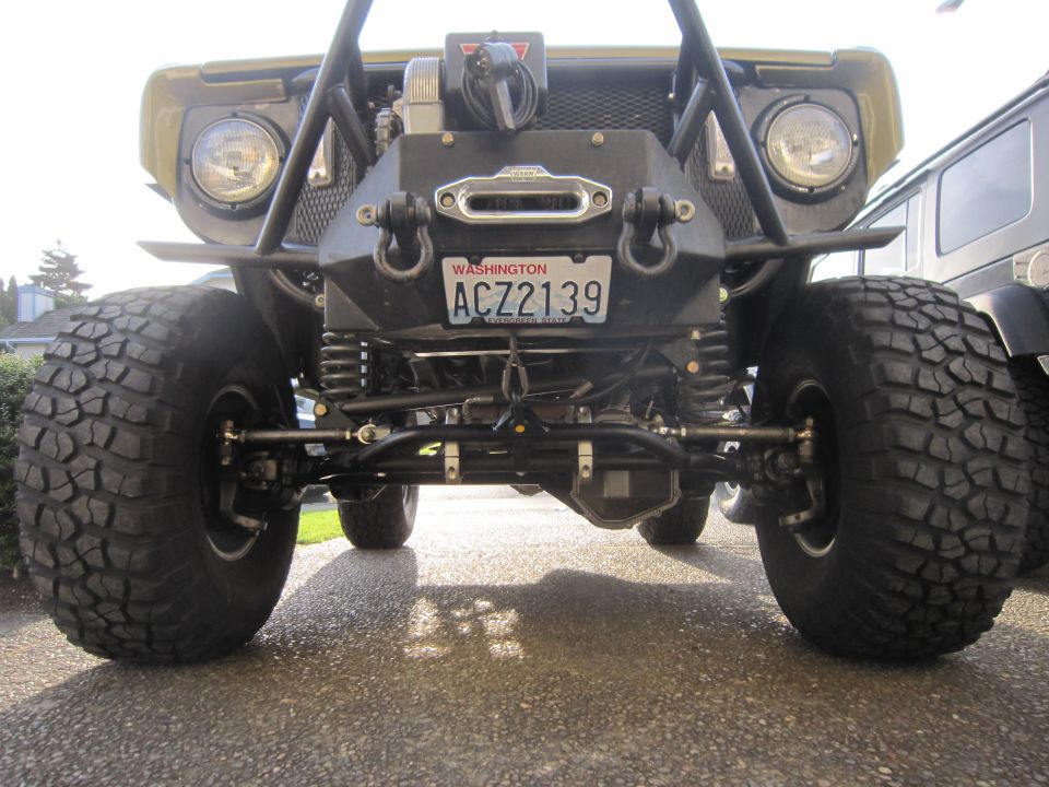 Modified off-road vehicle front bumper with winch and Washington license plate ACZ2139