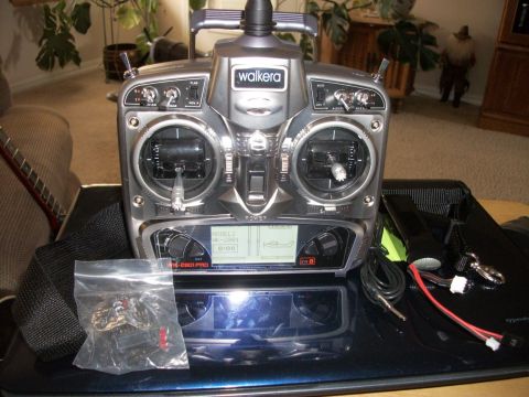 1996 Ford Bronco - Remote control transmitter with screen and various cables and accessories.