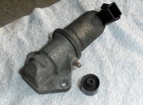 1990 Ford Bronco - This is a close-up of an EGR valve, a component of a vehicle's emission control system.