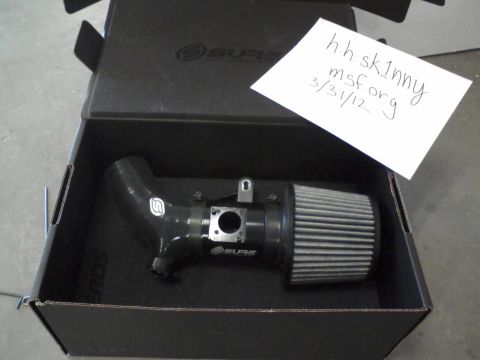 1987 Ford Bronco - New cold air intake system shown in its original packaging with a note dated 3/31/12.