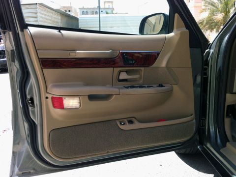 2001 Mercury Grand Marquis - Interior view of the front passenger door panel on a 2001 Mercury Grand Marquis.