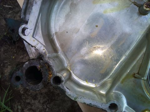 1994 Ford Bronco - This is a close-up view of a used engine component, showing signs of wear and tear.