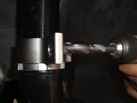 1995 Ford Taurus - Drilling into a coilover shock absorber, part of the SHO suspension system.