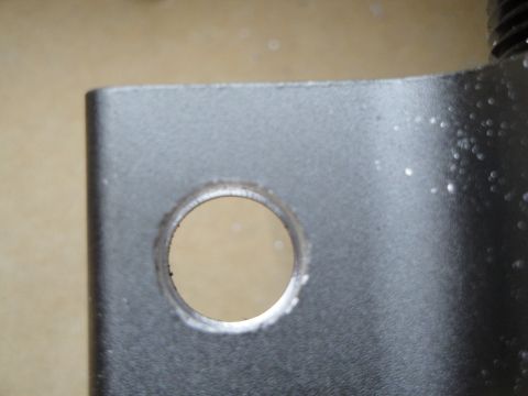 1995 Ford Taurus - A metal bracket with a hole is shown in detail.