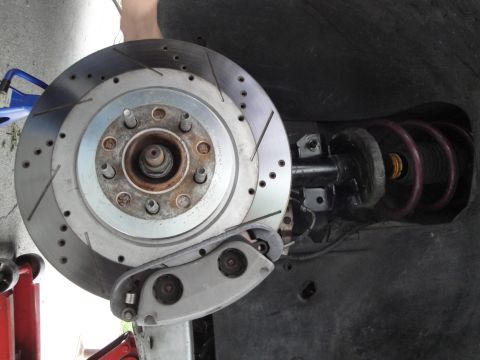 1995 Ford Taurus - Front brake rotor and suspension components are visible in this close-up shot.