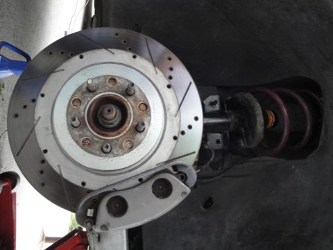 1995 Ford Taurus - This image shows a car's brake rotor and suspension components, not a full vehicle.