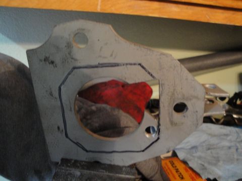 1995 Ford Taurus - A metal bracket is shown with a marked outline and a circular opening, possibly for a component.