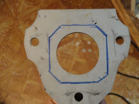 1995 Ford Taurus - A metal component with blue marker lines drawn around a central circular opening, likely for modification or identification.
