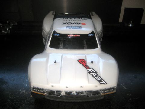 1996 Ford Bronco - Front view of a white RC car body with racing decals and a Ford emblem.