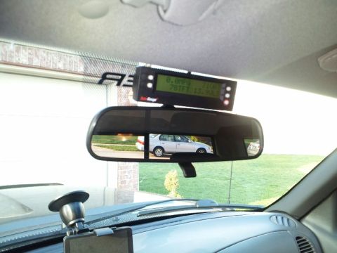 2011 Ford Ranger - Digital gauge mounted on the windshield reflects a sedan in the rearview mirror.