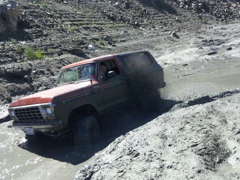 1978 Ford Bronco - This 1978 Ford Bronco is navigating a challenging muddy terrain.