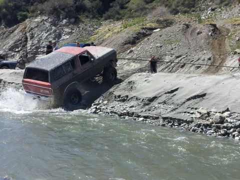 1978 Ford Bronco - Ford Bronco navigates a river crossing during an off-road excursion.