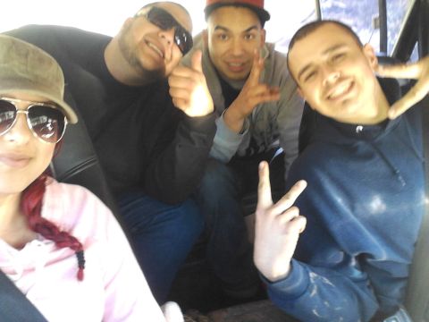 1978 Ford Bronco - A group of friends take a selfie while riding in a vehicle.