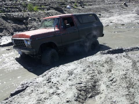 1978 Ford Bronco - This 1978 Ford Bronco navigates a muddy off-road course, kicking up spray as it goes.