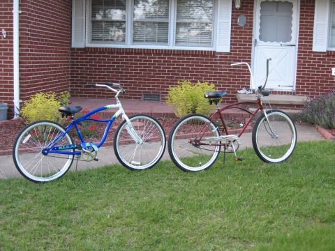 1994 Ford Bronco - Two cruiser bicycles are parked on the grass in front of a house.
