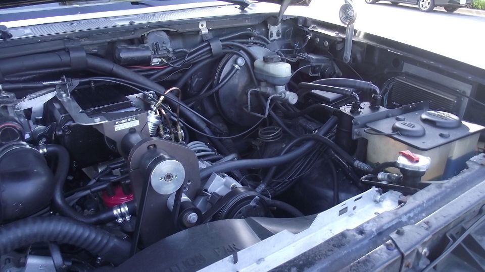 Engine bay with supercharger and oil catch can installed