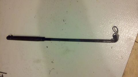 1978 Ford Bronco - A single metal rod part is shown against a textured surface.