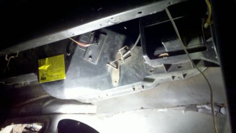 1978 Ford Bronco - Close-up of the HVAC blower motor housing, showing a yellow warning sticker.