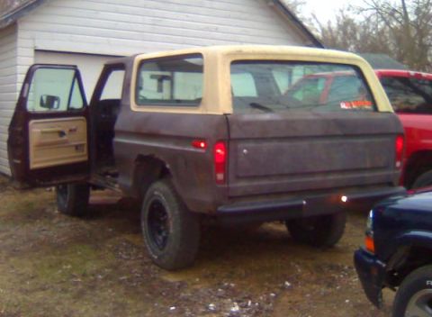 1979 Ford Bronco - This 1978 Ford Bronco shows significant rust and wear, with its driver's door ajar.