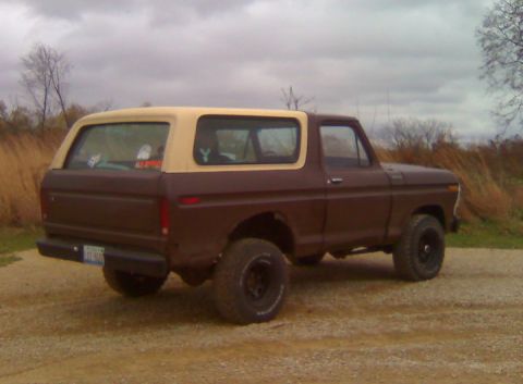 1979 Ford Bronco - This two-tone Ford Bronco is viewed from its rear three-quarter angle on a cloudy day.