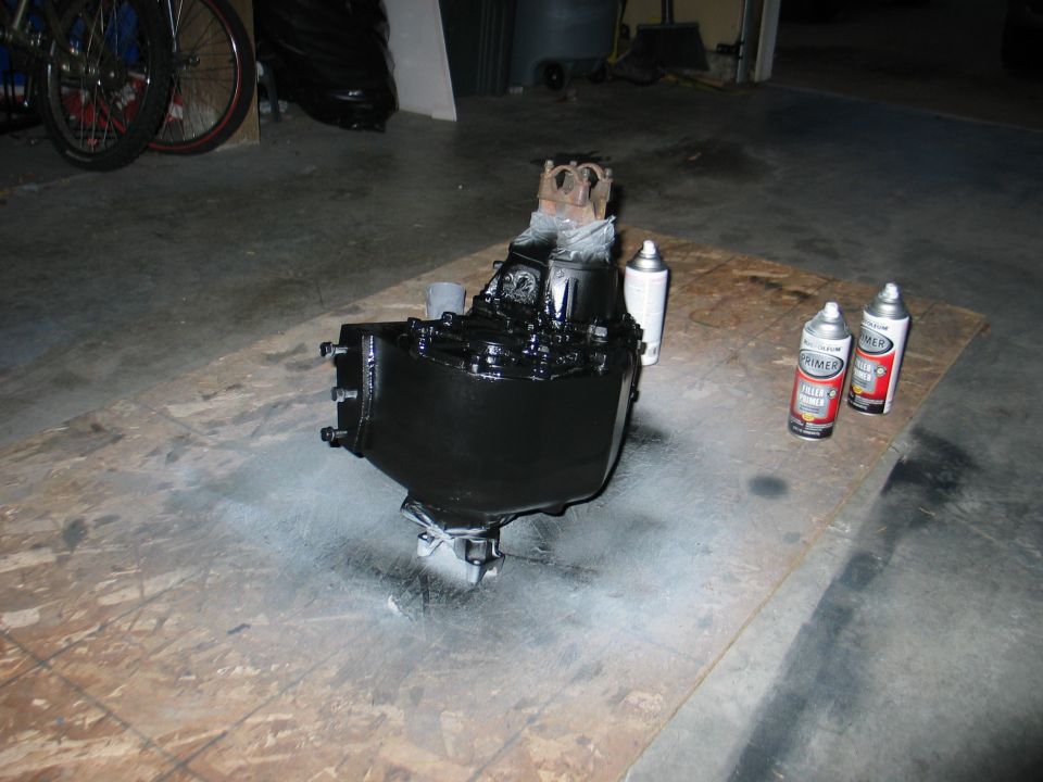 Black painted transmission or transfer case with spray cans