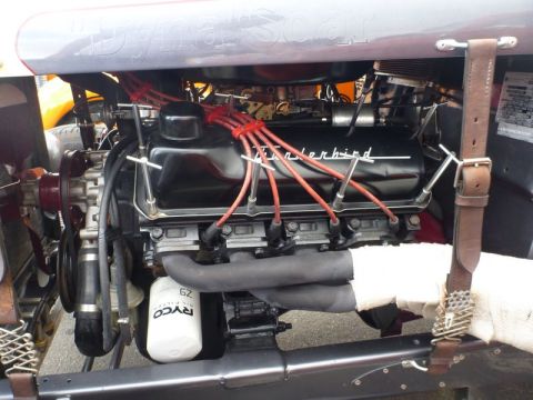 1969 Lincoln Continental - The engine compartment features a prominent V8 engine with "Thunderbird" branding on the valve covers.