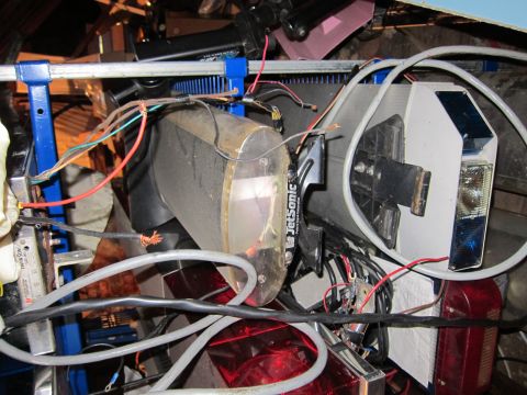 1991 Ford LTD Crown Victoria - A jumble of vehicle components and electrical wiring is visible in this close-up shot.