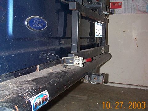 1986 Ford Bronco - Rear view of a 1986 Ford Bronco, showing the bumper, tire carrier, and hitch assembly.