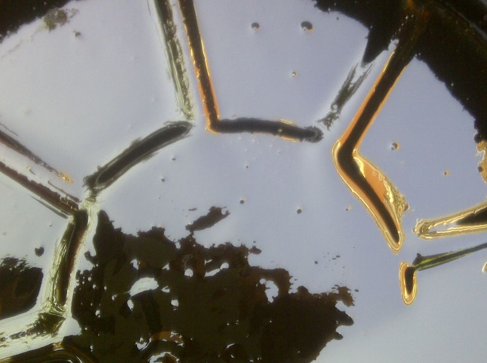 Oil in a pan with a geometric pattern