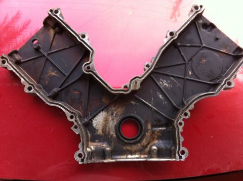 1998 Ford Crown Victoria - This is an engine timing cover, likely from a V-engine, shown from the inside.