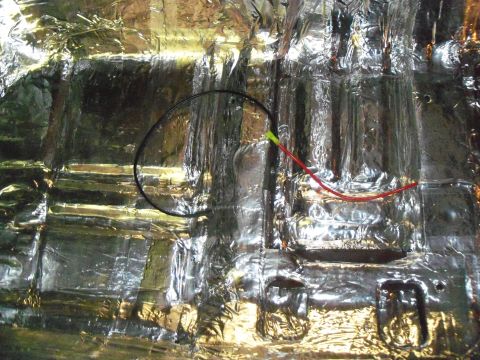 1979 Ford Ranchero - Close-up of a floor pan or firewall covered edge-to-edge in foil-faced butyl sound deadener, hand-rolled down over every stamped rib, conto…