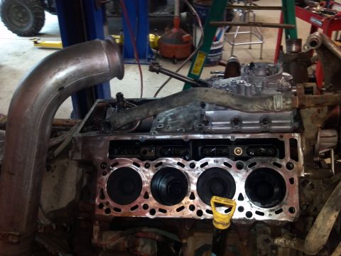 1993 Ford F-150 - Close-up of an engine block during repair, showing the cylinder bores and internal components.