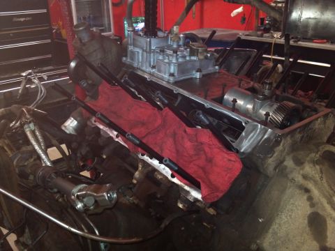 1993 Ford F-150 - Engine components are visible in a garage setting, with tools and equipment in the background.