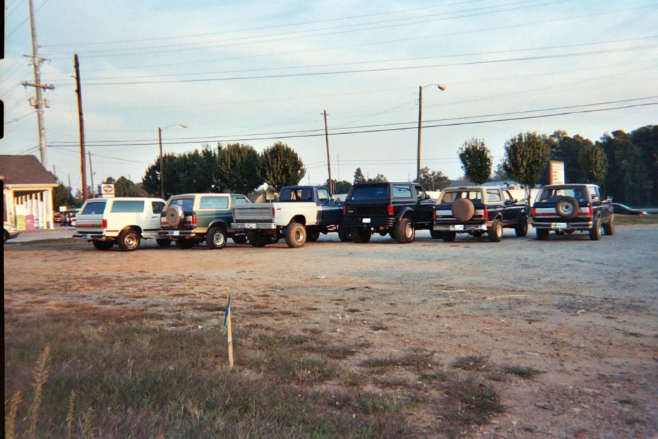 White 1987 Ford Bronco parked in a lot with other vehicles