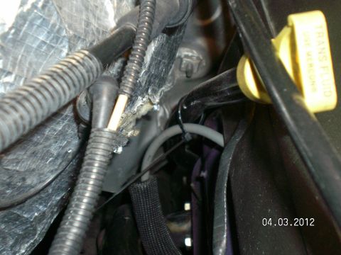 1996 Ford Bronco - Transmission fluid dipstick visible in engine bay, with date stamp 04.03.2012.