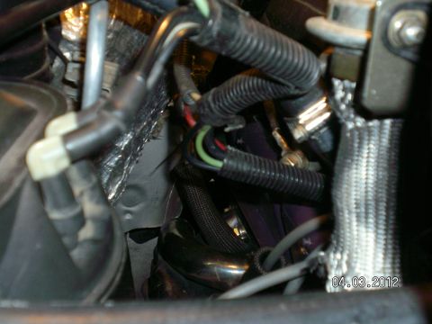 1996 Ford Bronco - Close-up view of the engine bay wiring and hoses, with a date stamp of 04.03.2012.