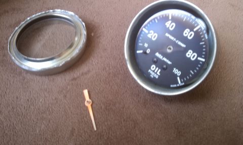 1978 Ford Bronco - Disassembled Auto Meter oil pressure gauge with bezel and needle separate.