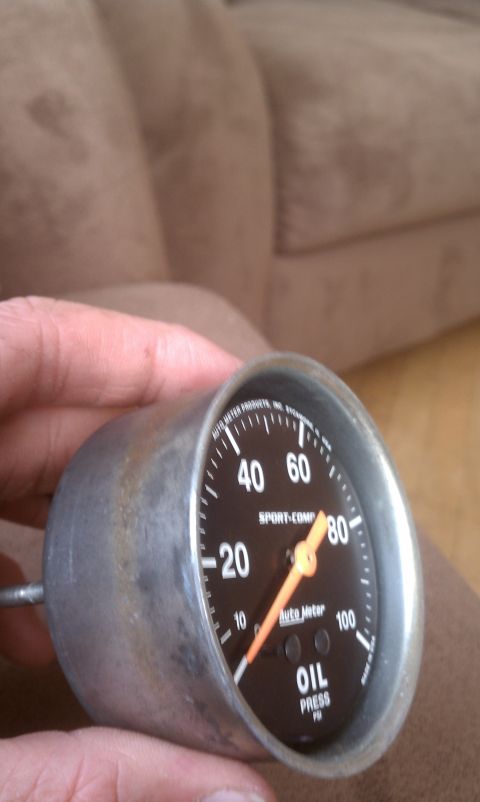 1978 Ford Bronco - A close-up shows an Auto Meter oil pressure gauge with PSI markings and an orange needle.